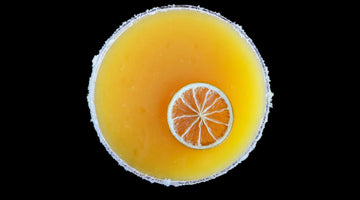 Orange cocktail with citrus slice garnish
